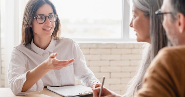 A young woman works with her financial professional.