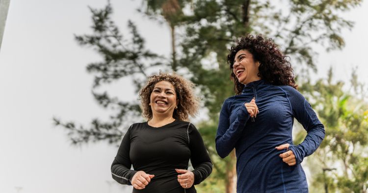 A woman and her adult daughter go for a run in the park