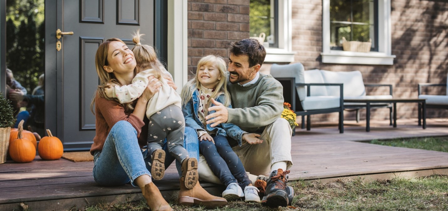 A young family enjoy an autumn day together.